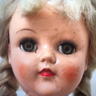 BEFORE: A Toni doll with lots of facial damage.